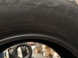 a close up of a tire with a tire sticker on it