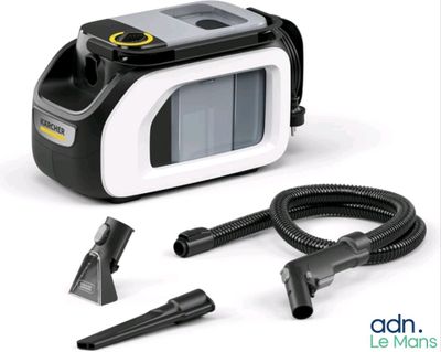 a black and white photo of a vacuum and a hose