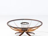 an image of a glass and wood coffee table with a circular glass top