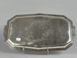 a silver tray with a handle and a handle on it