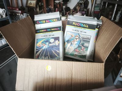 two dvds in a cardboard box on a table