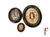 three framed pictures on the wall of a room