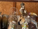 a shelf with vases and other decorative items on it