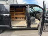 a van that has been vandalized and is parked in a parking lot