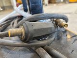 a close up of a bunch of hoses on a cart