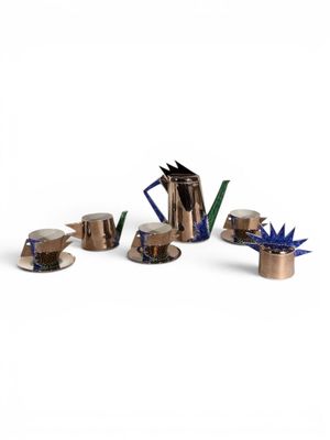 an image of a group of metal objects sitting on top of a white surface