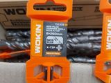 two orange tools that are sitting on top of a box