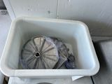 an image of a toilet with a trash can in it