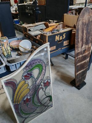 several pieces of art are sitting on a table in a room