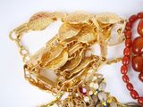 a lot of jewelry that is laying on a table