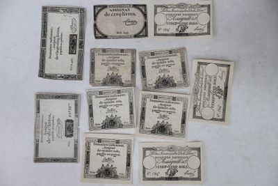 several old money notes are laid out on a white surface