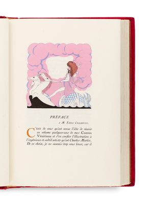 un livre ouvert sur lequel figure l'image d'une femme et d'un chat