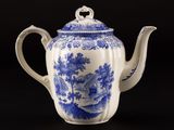 blue and white porcelain teapot with a bird and flowers design