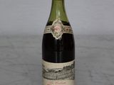 a bottle of wine that is sitting on a table