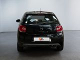 a picture of a black car parked in a room