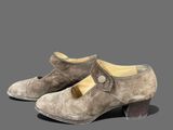 pair of women ' s shoes on a grey background