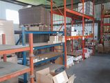 shelves in a warehouse with boxes and boxes on them