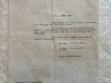 an old letter from a man that is sitting on top of a piece of paper