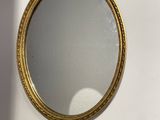 a mirror that is hanging on the wall in the room