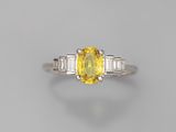 a yellow sapphire and diamond ring