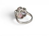an image of a close up of a ring on a white surface