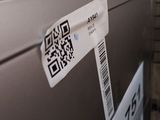 a picture of a refrigerator with a qr code on it