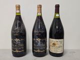 three bottles of wine are lined up on a counter