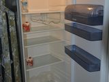 an open refrigerator with a lot of food inside of it