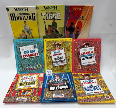 several children ' s books are lined up on a white surface