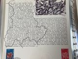 an open book with a picture of a map and stamps on it