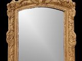 une image représentant un miroir à cadre doré sur fond noir