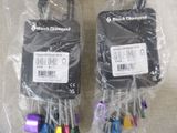 two black diamond cell phones wrapped in plastic bags