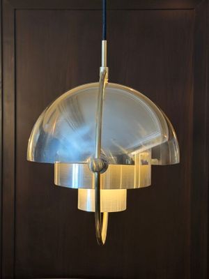 a lamp that is hanging from the ceiling in the room