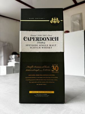 the box of the bottle is sitting on the table