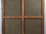 an image of a wooden frame with a brown fabric covering