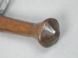 a close up of a hammer on a white surface