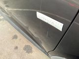 a sticker on the side of a black car