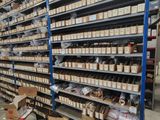 many shelves with boxes and boxes on them in a warehouse