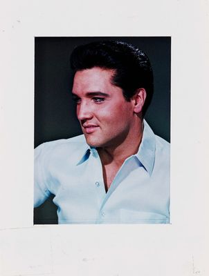 a black and white photo of a man in a blue shirt