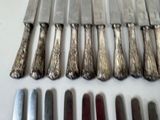 a lot of knives that are sitting on a table