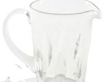 a clear glass cup and saucer sitting on a saucer