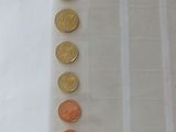 a lot of coins in a plastic bag on a table