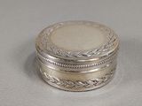 pair of silver and mother of pearl boxes on a white surface
