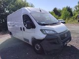 a white van that is parked on the side of the road