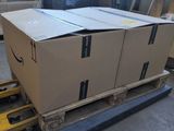 boxes on a pallet in a warehouse with pallets in the background