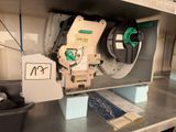 a machine that is sitting on a shelf in a room
