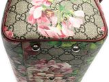 a purse with flowers on it sitting on a table