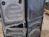 two speakers sitting next to each other in a room