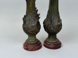 two vases that are sitting next to each other