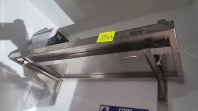 a stainless steel oven with a yellow sticker on it